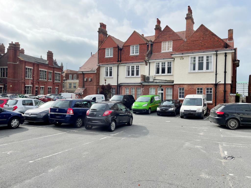 Lot: 61 - TWO SUBSTANTIAL FORMER OFFICE BUILDINGS WITH CONVERSION POTENTIAL - Rear view of 2-4 with parking area